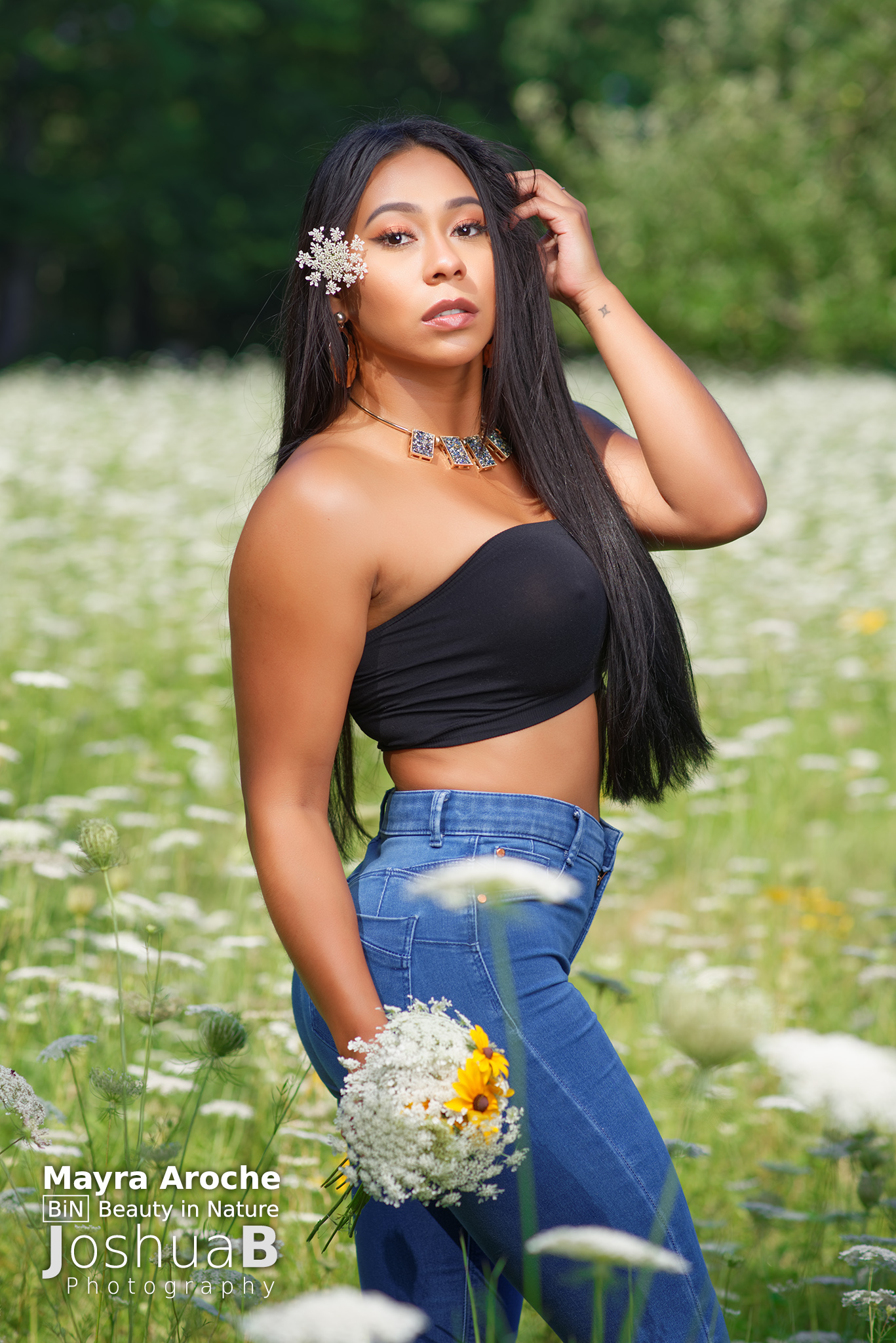 Beautiful Latina woman wearing tube top in wildflowers