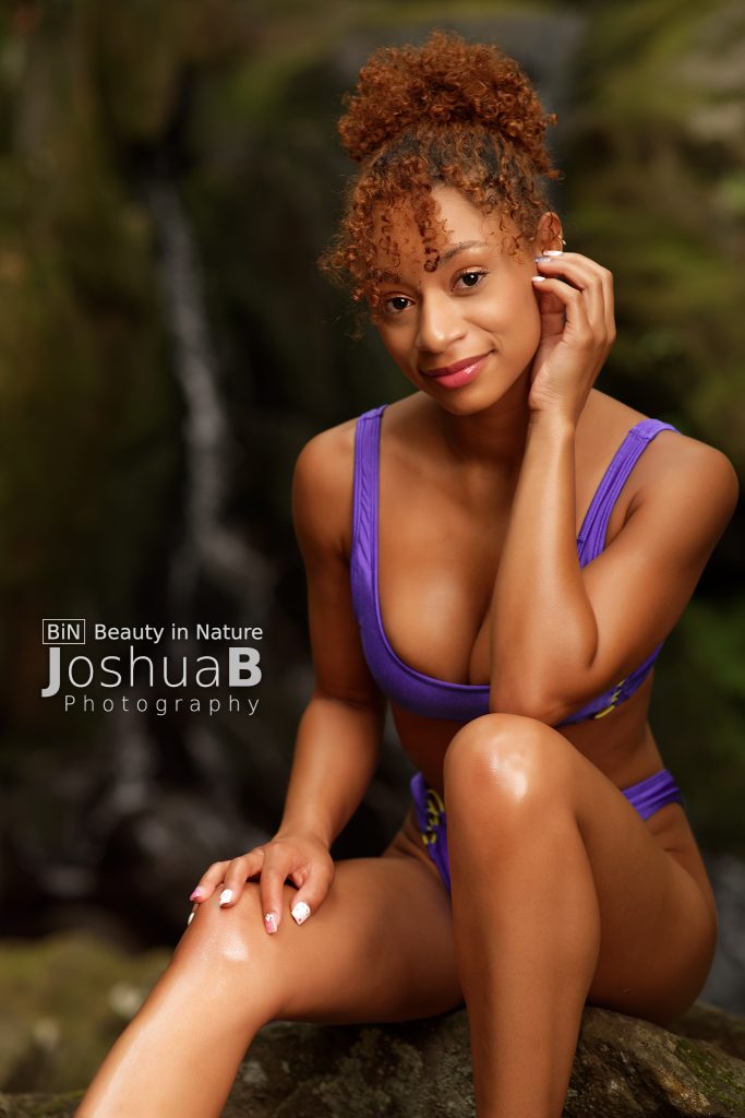 beautiful latina model purple bikini waterfall seated