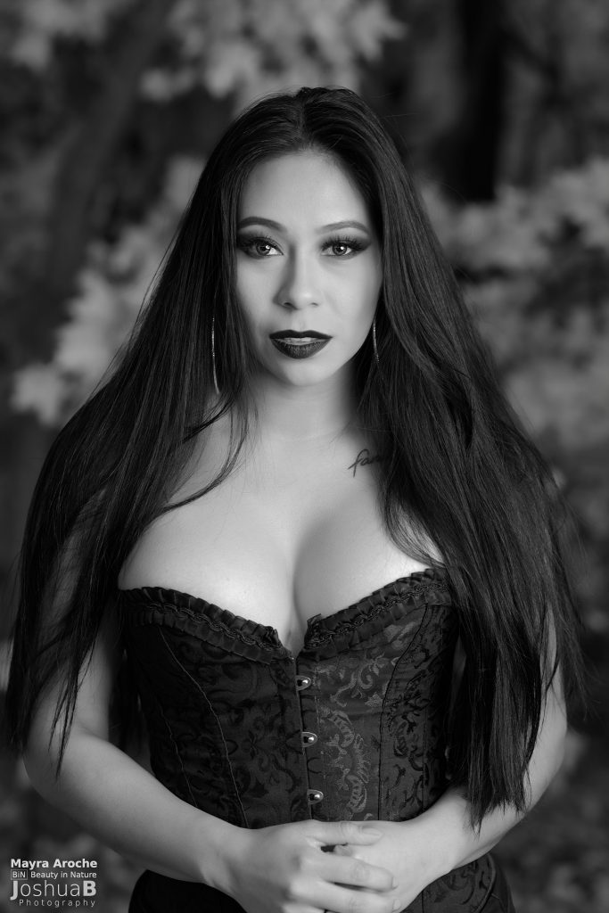 Sexy Latina in Halloween makeup wearing black corset