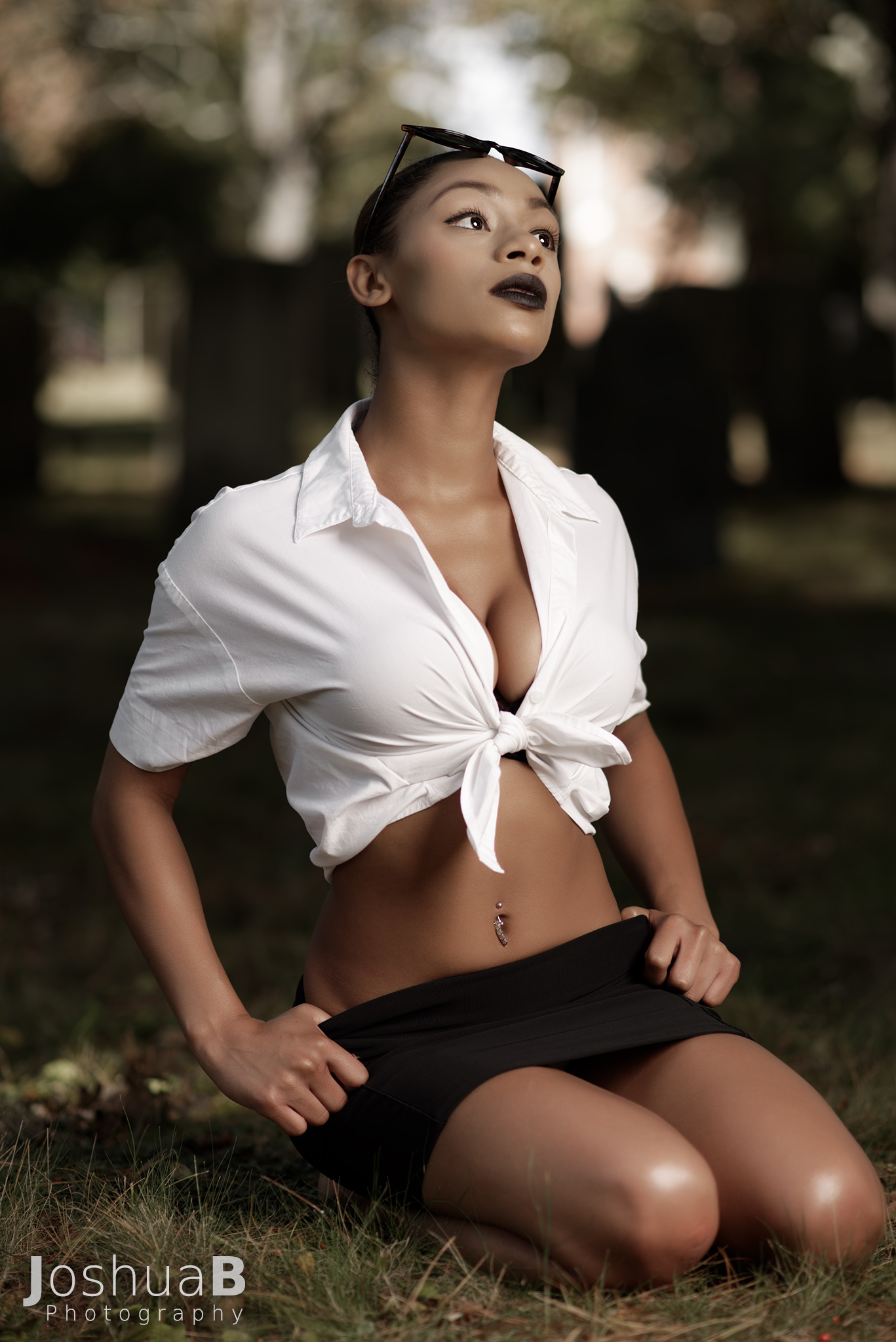 Beautiful Latina in sexy school girl Halloween outfit, looking up