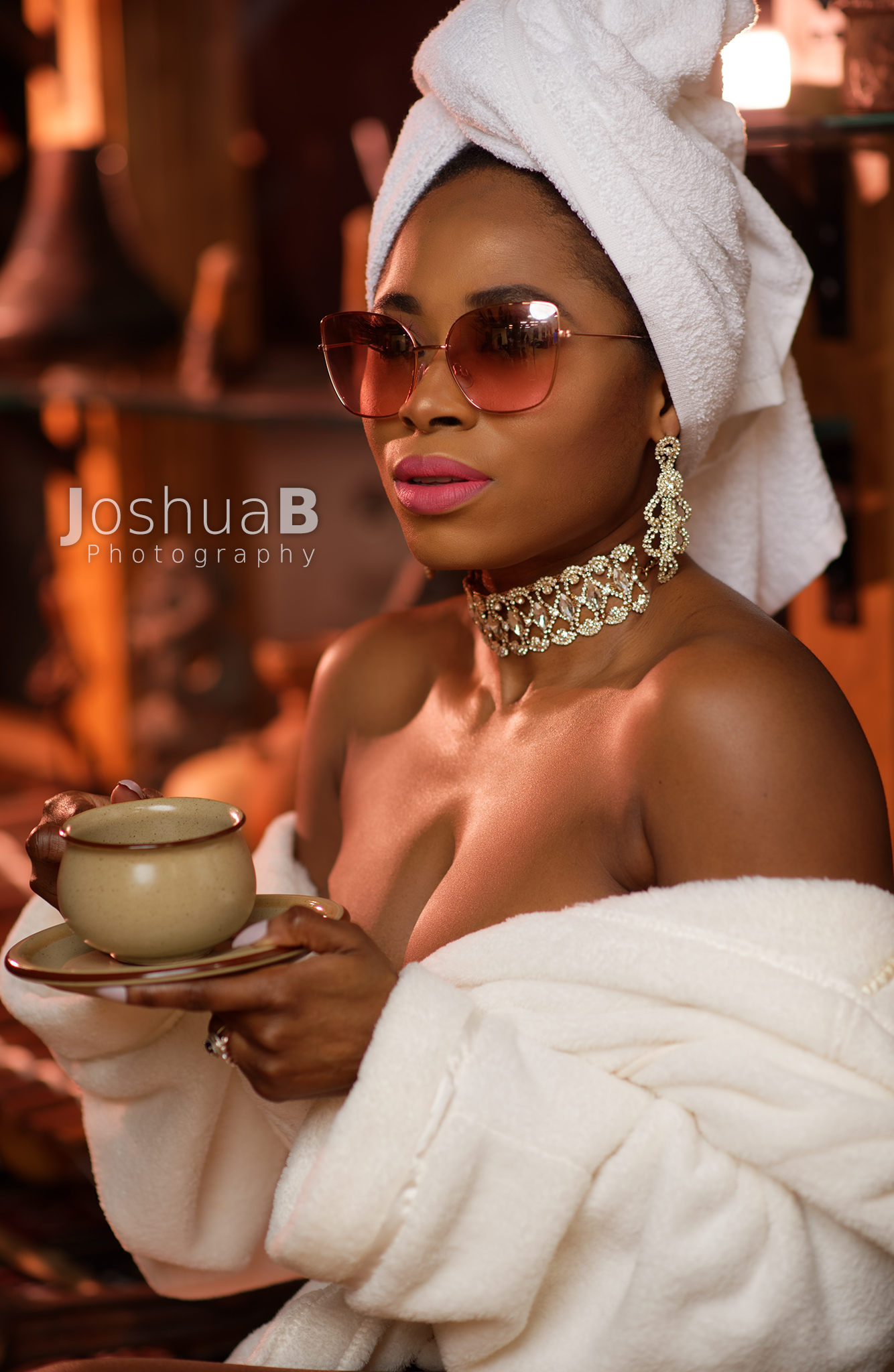 Abidemi Oke fashion blogger in sunglasses and white bath towels closeup